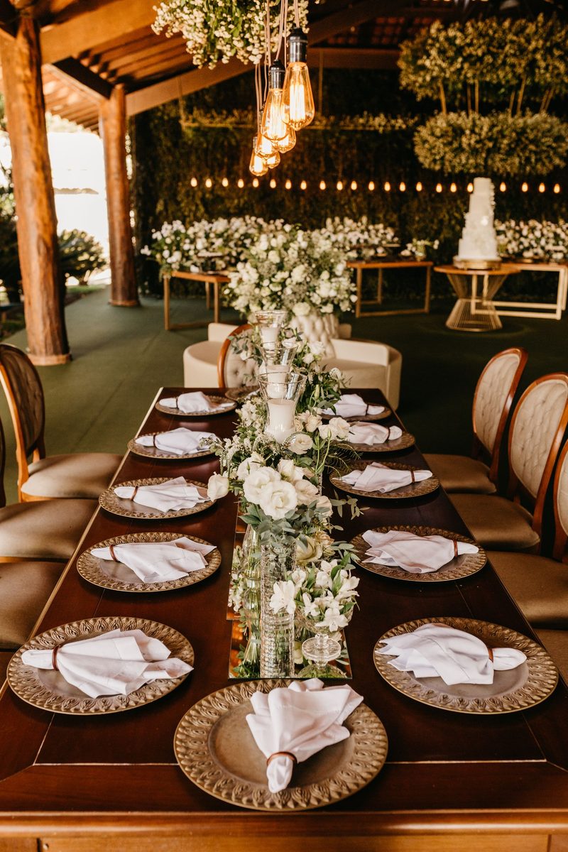 A long banquet table with florals and candlelight