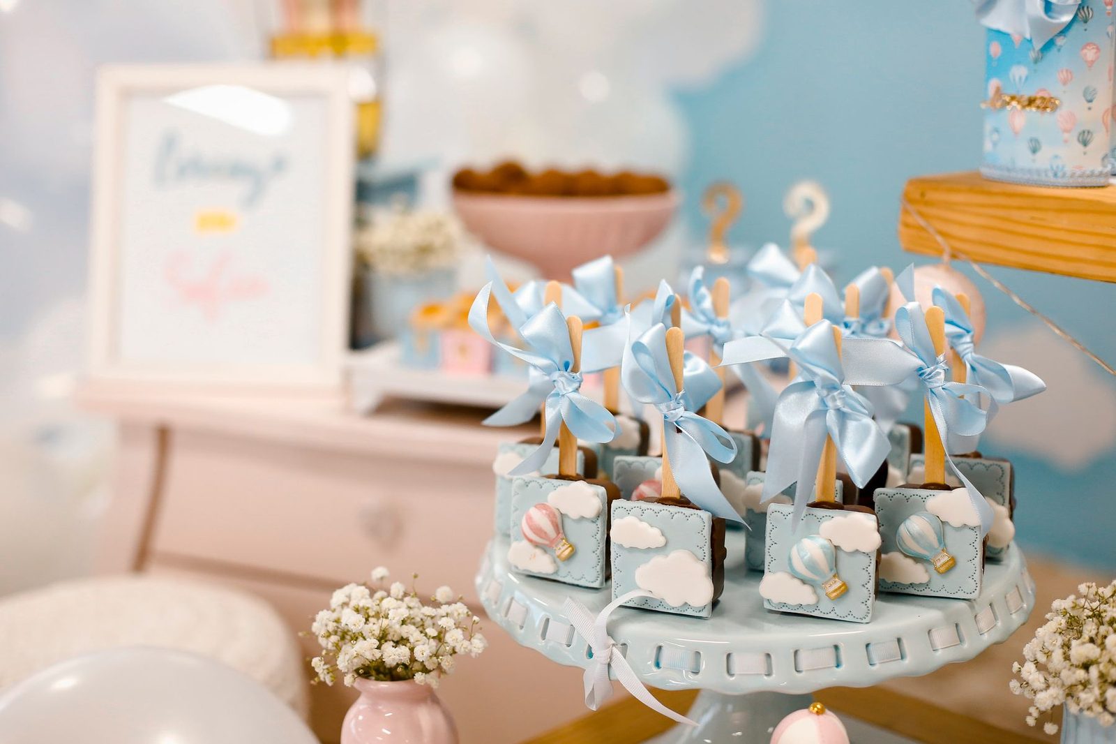 A pastel baby shower table with florals
